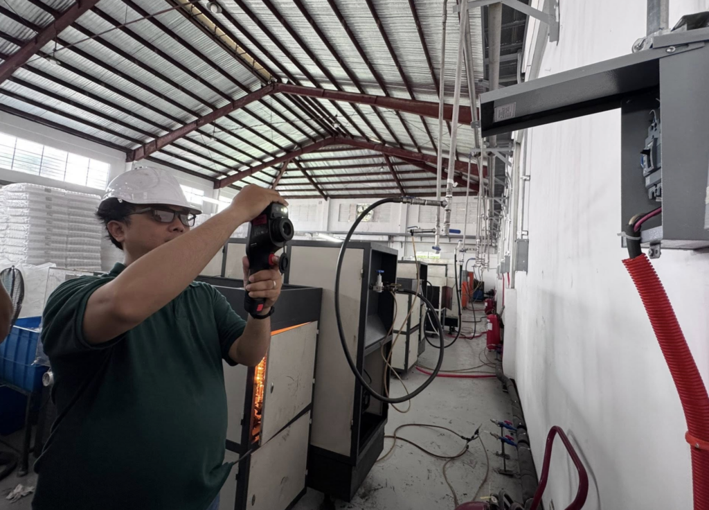 thermographer testing a panel board