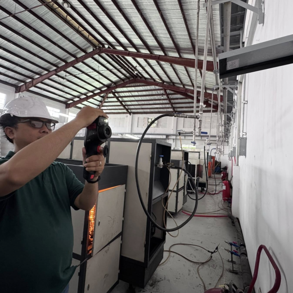 thermographer testing a panel board